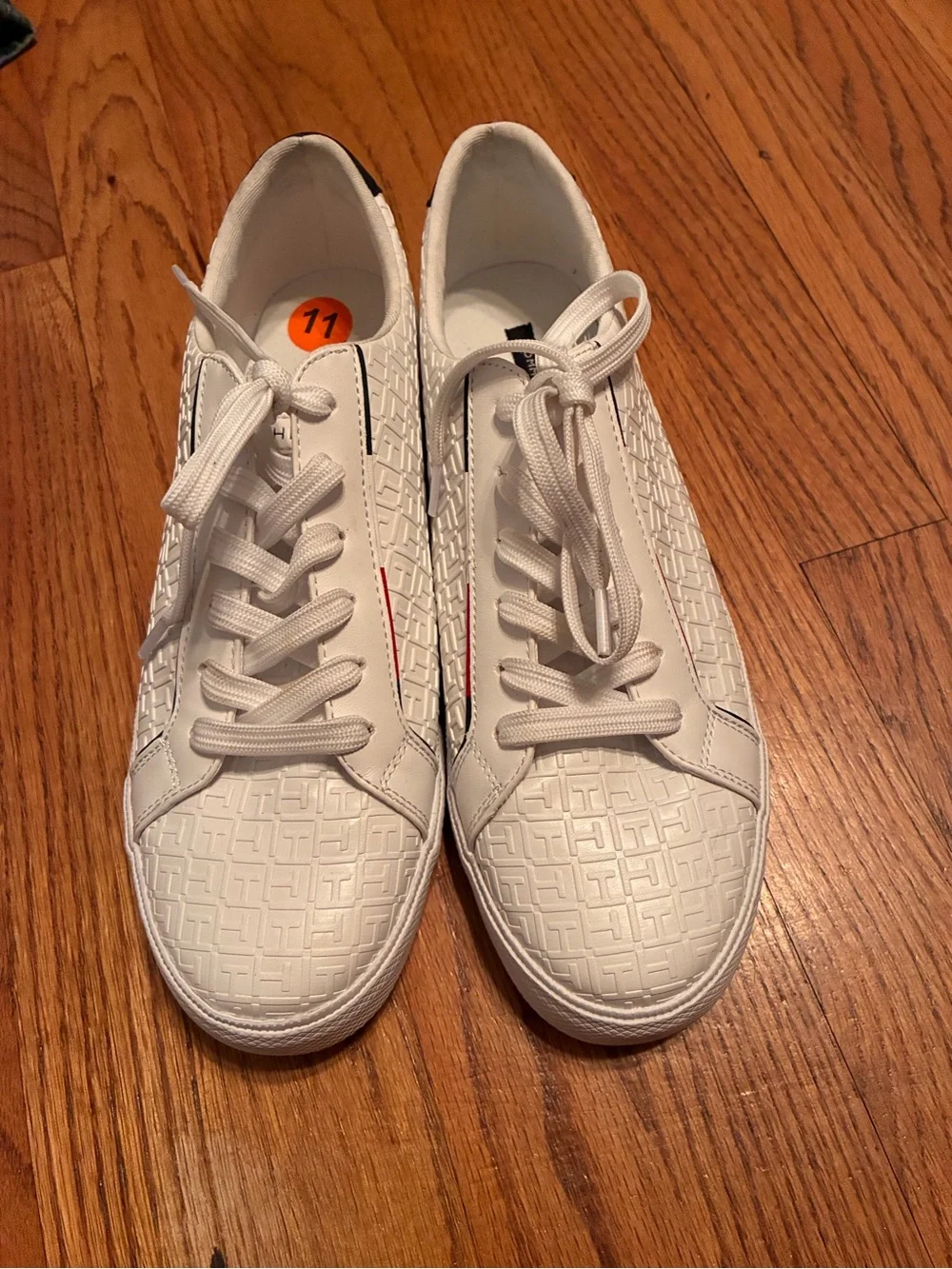 Tommy Hilfiger White Embossed Sneakers with Navy Heel and Red-White-Blue Stripe.